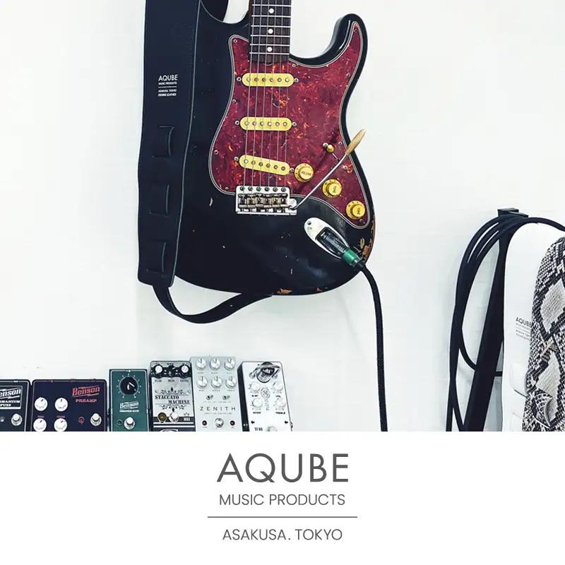 AQUBE MUSIC PRODUCTS ギターストラップ　シュリンク ブラック ［ M ］(裏面カラー：スムースオーク)_0029-004-T05-2