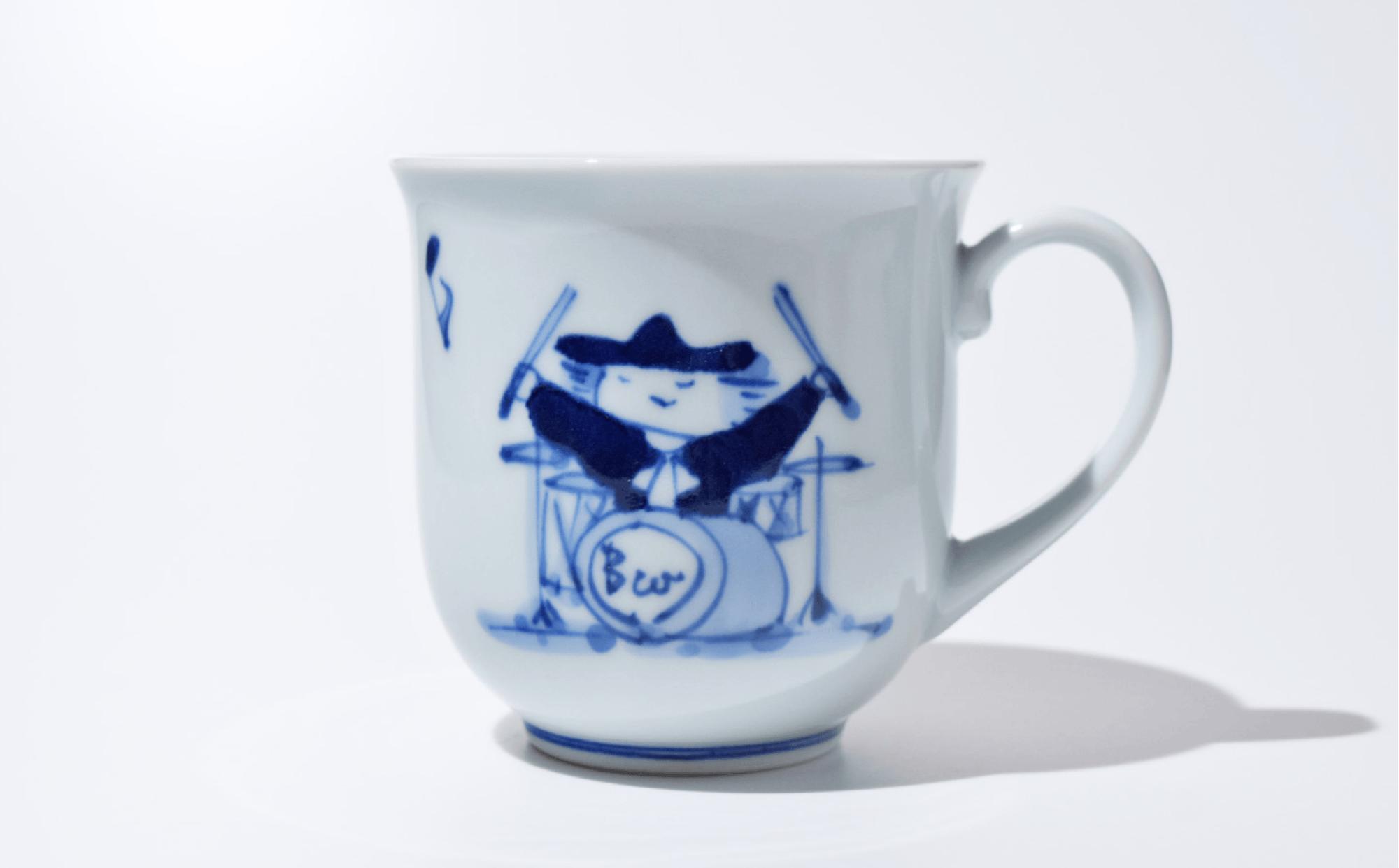 
            佐賀県で暮らす児童養護施設のこどもの就労支援協力企業「しん窯」の有田焼南蛮人音反マグカップ ドラム
          