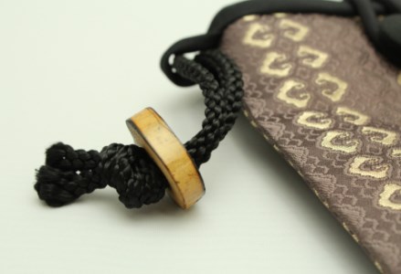 スマホポーチ（茶色柄）