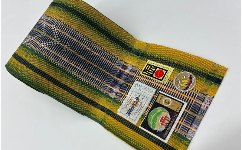 
            伝統工芸【読谷山ミンサー】半幅帯（常盤色・１点もの）
          